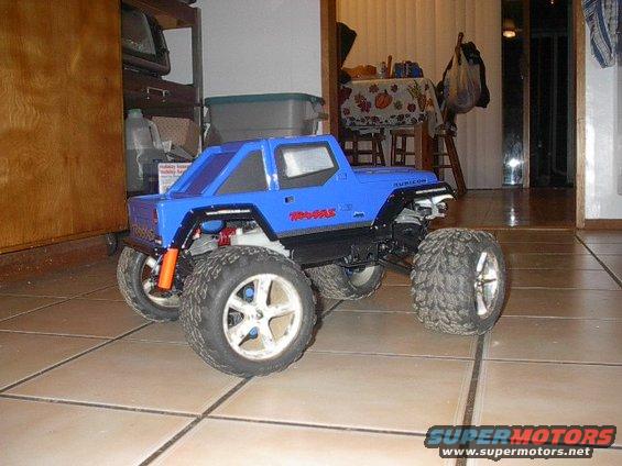 Blue remote control monster truck with Traxxas and Rubicon decals