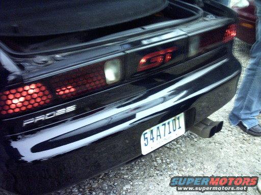 Black 1995 Ford Probe GT rear with honeycomb taillights and dual exhaust