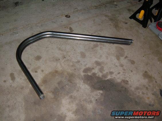 bent metal tube, looks like part of a roll cage