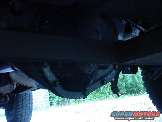 Undercarriage view of a vehicle's differential and exhaust pipe