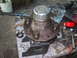 1990 Ford Bronco - A 4x4 hub assembly sits on a table surrounded by tools, suggesting a repair or maintenance task.