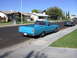 1966 Ford Ranchero - Blue 1966 Ford Ranchero parked curbside on a sunny day with a green convertible in the distance.