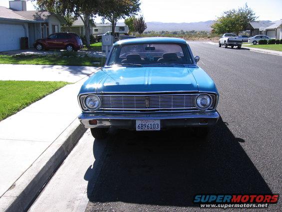 front view of a blue 1966 Ford Falcon parked on a residential street