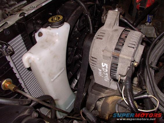 There's the stock Lincoln overflow tank in position, mounted around the taurus electric fan. Not a bad fit at all.