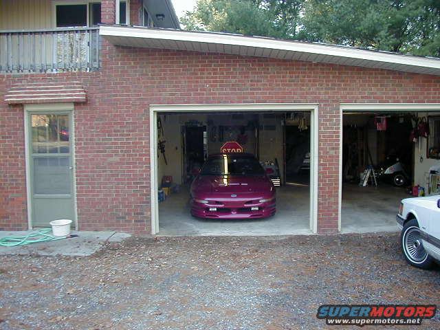 Purple 1994 Ford Probe front view in garage
