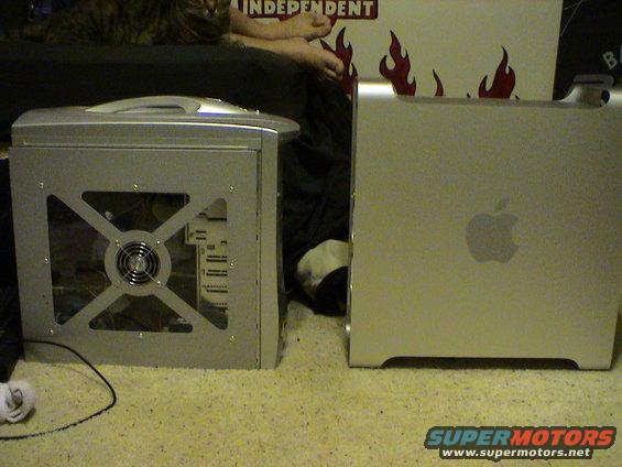 Two silver computer towers side-by-side on a carpeted floor