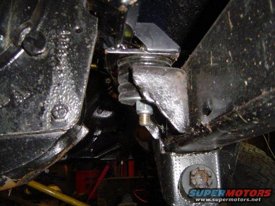 Undercarriage suspension mount with rubber isolator