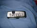 1997 Ford Crown Victoria - A car alarm remote is shown against a blue cloth background.