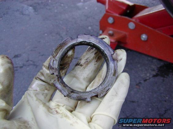 brakes-113005-010.jpg outer lock ring removed. this may be tight. be careful to keep the tool straight.. i belive the tq is like 75 ft lbs