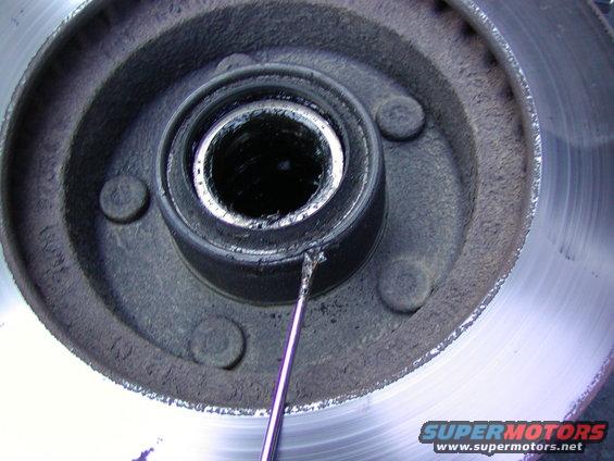 pry off the wheel seal with a small screw driver and a hammer. 