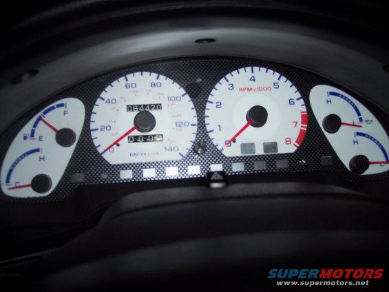 Dashboard gauges with speedometer, tachometer, fuel, and temperature indicators. Odometer reads 084420