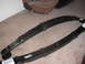 1991 Ford Bronco - A pair of black leaf springs, one with the number 780021 printed on it, are laid out on a carpeted floor.