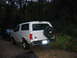1995 Ford Bronco - Rear view of a white 1995 Ford Bronco XL with a spare tire cover, parked outdoors.