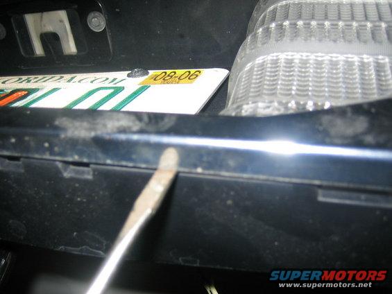 Use a flat head carefully along the bottom of the middle part to pry it off moving slowly accross the bottom.