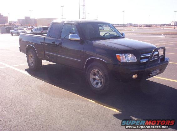 Black 2003 Toyota Tundra with bull bar parked in a lot