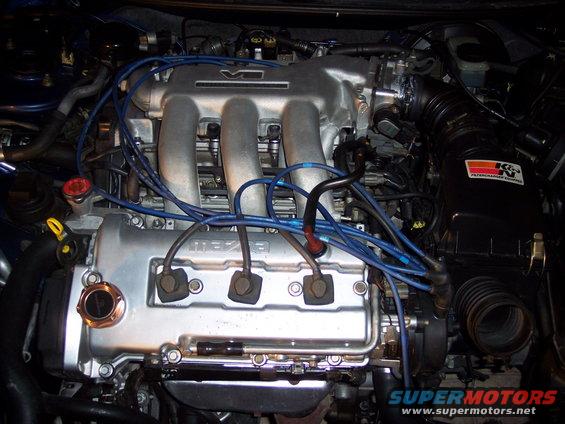 Engine bay with V6 intake manifold and Mazda branding