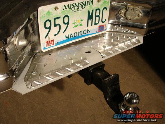 dsc00048.jpg A custom rear bumper step. Made out of diamond plate and cut to fit and painted with a weatherproof aluminum finish. 