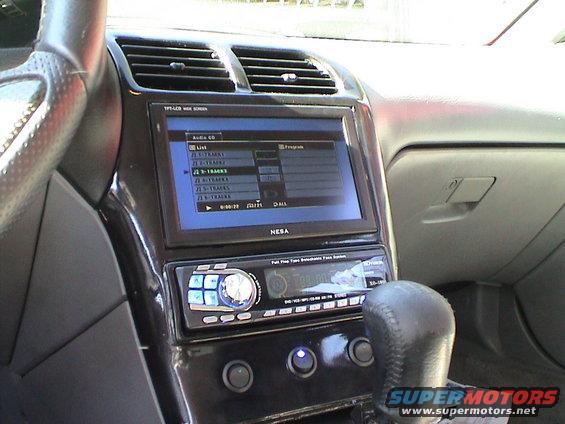 Aftermarket NESA screen and Kenwood stereo installed in a car's dashboard