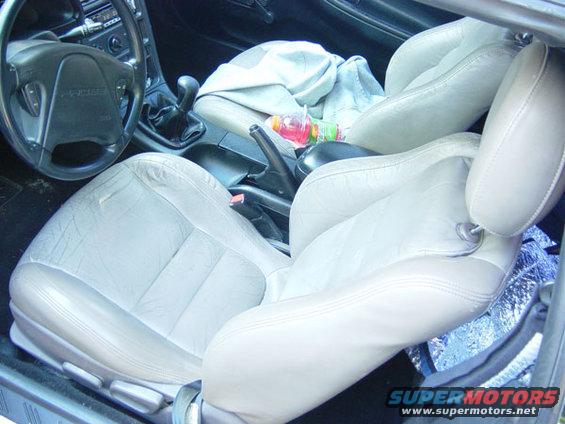 Interior of a 1993 Ford Probe showing front seats, steering wheel, and center console