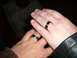 1996 Ford Probe - Two hands, each adorned with a black ring silver stripes, are gently crossed.
