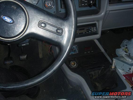 Ford steering wheel, dashboard, and center console with a stick shift
