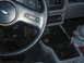 1986 Ford Mustang - Interior view of a car, showing the steering wheel, dashboard gauges, radio, and gear shifter.