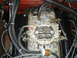 1986 Ford Mustang - Engine bay detail showing a carburetor and associated fuel and electrical lines.