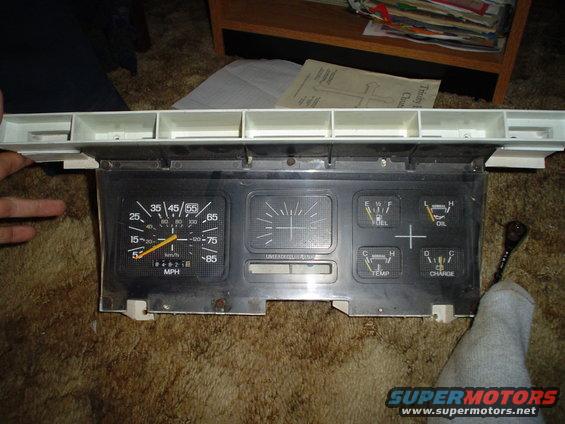 Dashboard instrument cluster with speedometer, fuel, oil, temperature, and charge gauges