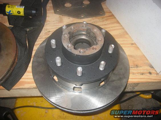 img_1264.jpg Put the rotor on the hub, painted the previous day. Sandblasted the lug studs and reused them.