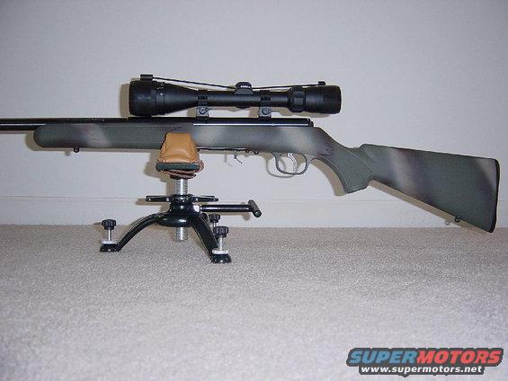 Rifle with scope on a shooting rest