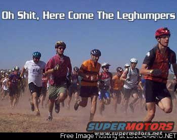 Group of people running a race, wearing helmets and athletic gear