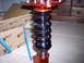 1995 Ford Probe - Close-up of an adjustable coilover suspension part, likely for aftermarket use.