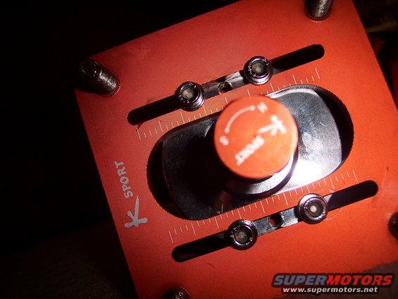 K Sport adjustable suspension component with orange knob and measurement markings