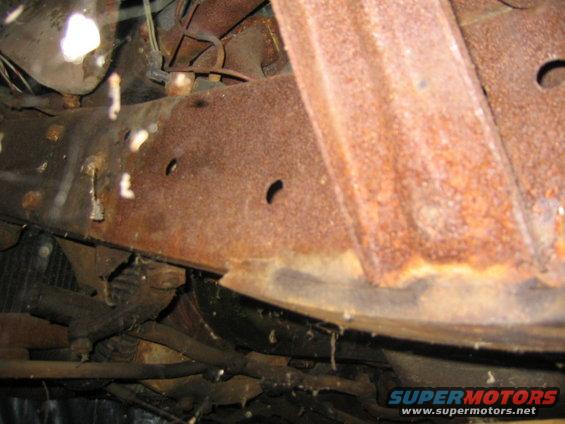 Heavily rusted vehicle frame and suspension components