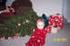 1987 Toyota 4Runner - A baby in red pajamas sits on the floor next to a decorated Christmas tree and wrapped gifts.