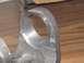 1990 Ford Bronco - Metal component with a hole, likely a vehicle part.