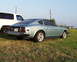1978 Nissan 240SX - Rear view of a light blue 1978 Nissan 280Z with a white SUV beside it.