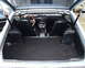 1978 Nissan 240SX - The interior of a 1978 Nissan 240SX is visible, along with its open trunk space.