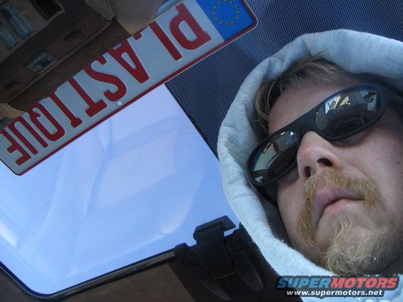 Interior view of a car with a license plate reading PLASTIQUE