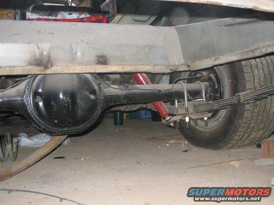 Rear axle assembly with red shock absorbers and leaf springs