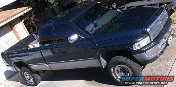 1997 Dodge 2500 pickup truck parked in driveway next to garage
