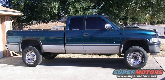 Side view of a 1997 Dodge 2500 pickup truck parked in a driveway