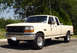 1993 Ford F-250 - This Ford F-250 pickup truck is shown from the front three-quarter view, parked outdoors.
