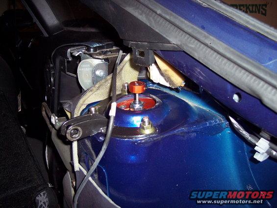 Blue 1995 Ford Probe strut tower with orange adjustable coilover
