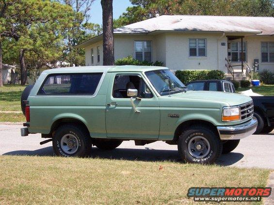 1994 Ford Bronco parked on grass, side view