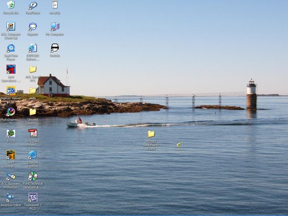Desktop screenshot of a lighthouse and a boat on the water