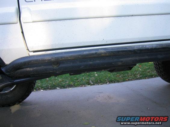 1997 Jeep Cherokee side view showing rock sliders installed below the doors