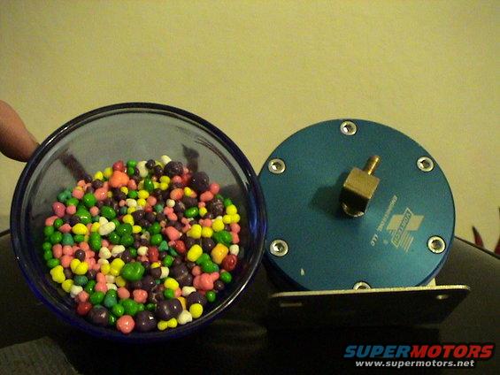 Blue blow-off valve with Vortech logo next to a bowl of colorful candy
