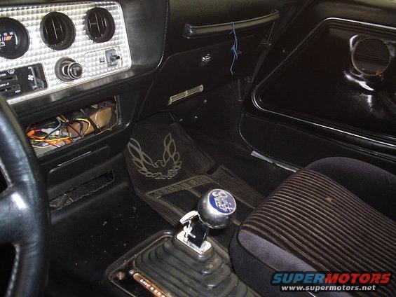 1979 Pontiac Trans Am interior with bird floor mats and shifter