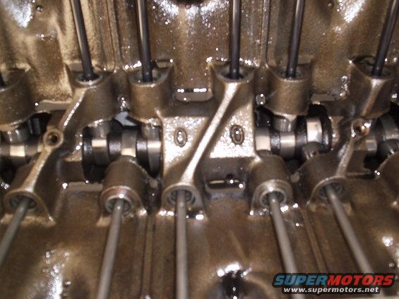 Close-up of engine valve train with pushrods and rocker arms